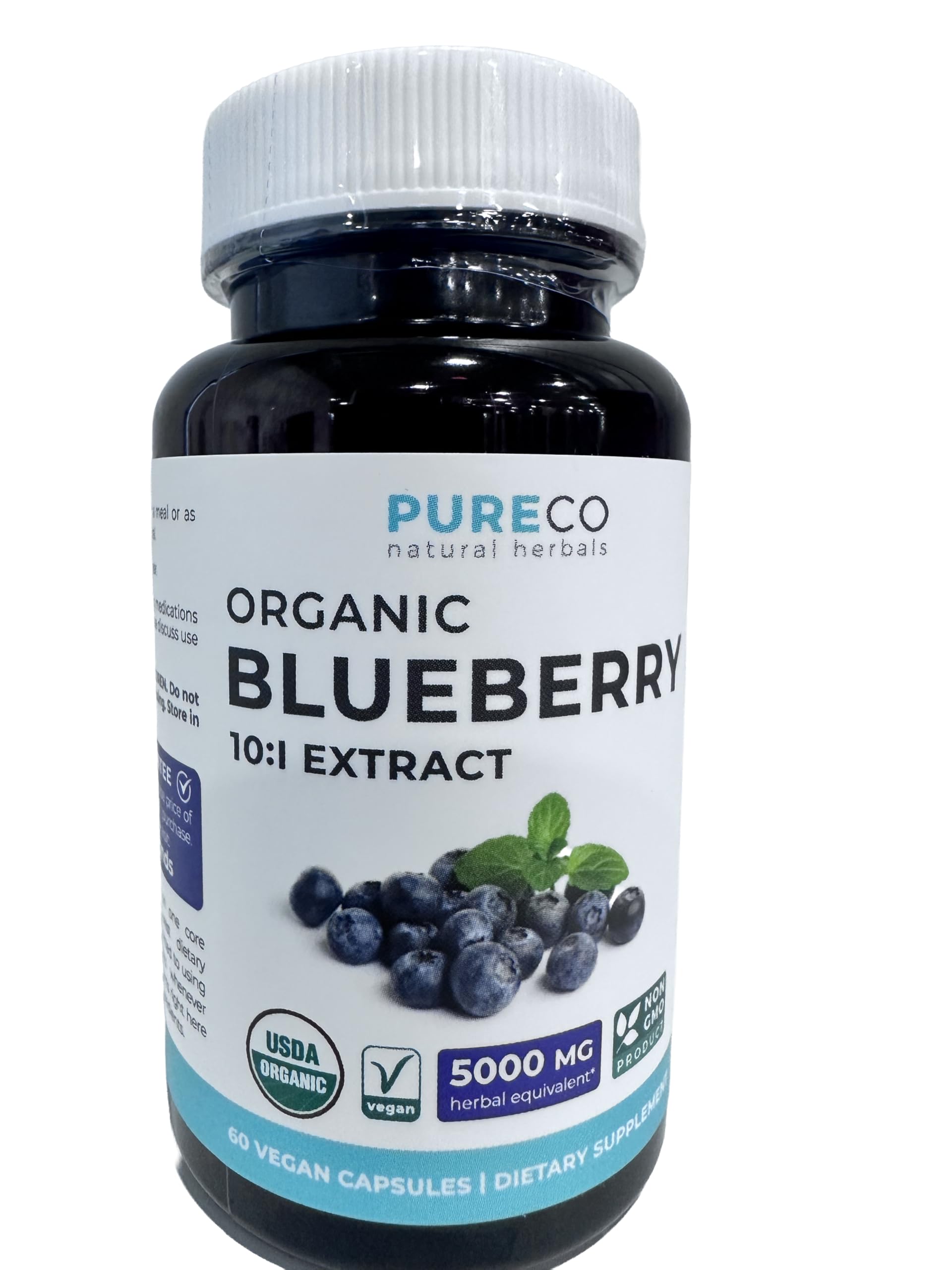 PURE CO Blueberry Extract Supplement 68g capsules in a hand