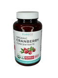 PURE CO Cranberry Extract capsules in a hand