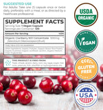 PURE CO Cranberry Extract capsules on a wooden surface