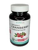 PURE CO Organic Cranberry Concentrate bottle with a plant background