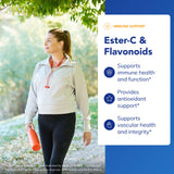 Pure Encapsulations Ester-C Vitamin C Supplement capsules on a wooden surface