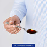 Pure Encapsulations Liquid Magnesium Glycinate 165mg pouring into a spoon