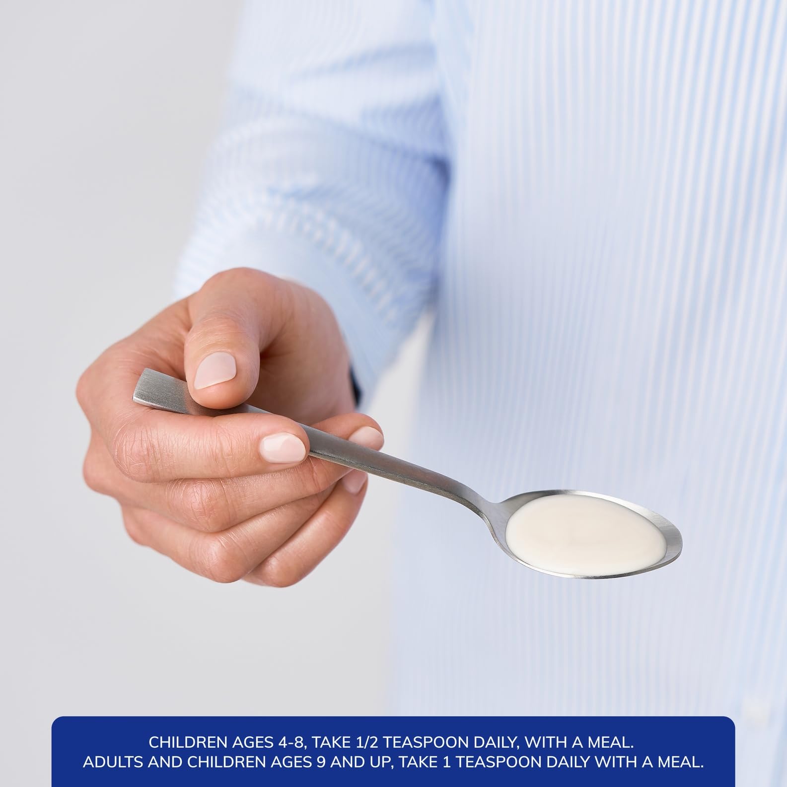 Pure Encapsulations Magnesium Glycinate Liquid 215mg pouring into a spoon
