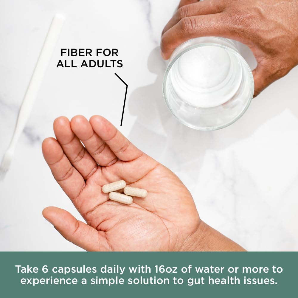 Pure for Men Psyllium Husk Fiber Capsules on a wooden table