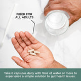 Pure for Men Psyllium Husk Fiber Capsules on a wooden table