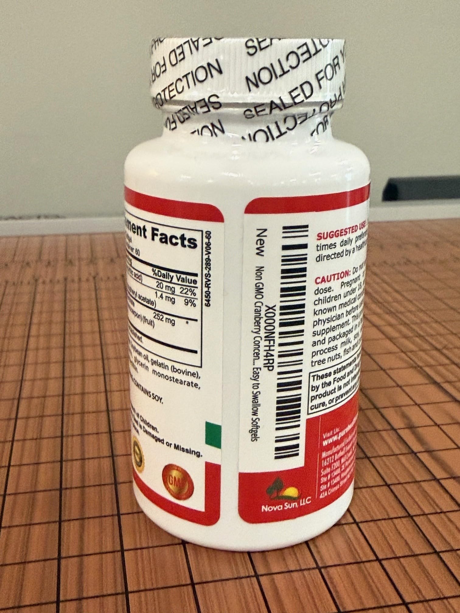 Pure Healthland Cranberry Concentrate Softgels on a table