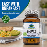 Pure Mountain Botanicals Cayenne Pepper Capsules on a wooden surface