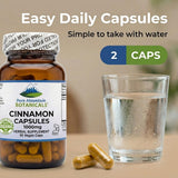Pure Mountain Botanicals Cinnamon Bark Capsules with a green plant background