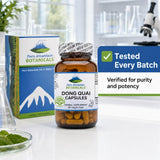Pure Mountain Botanicals Dong Quai 500mg capsules with a glass of water