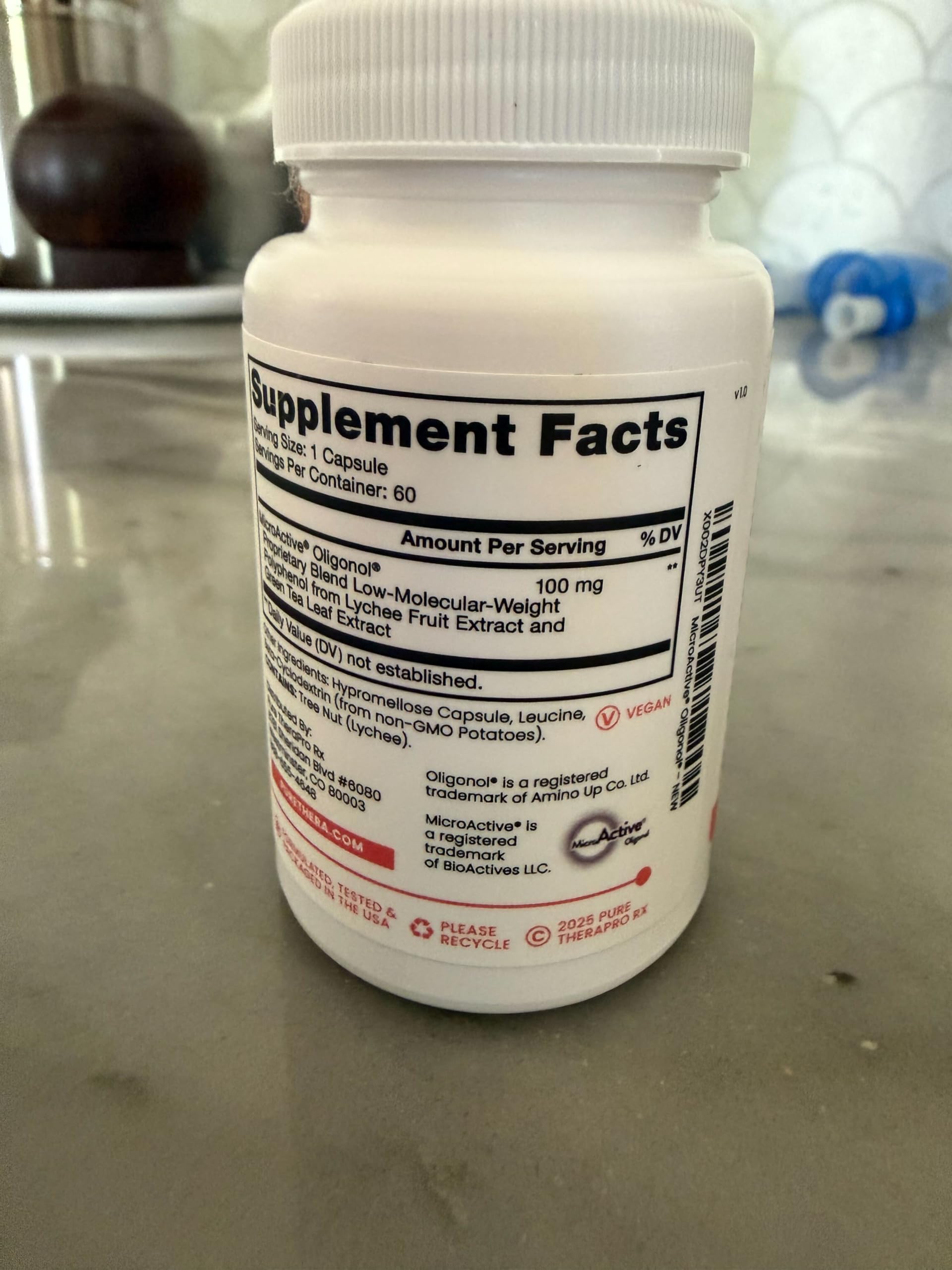 Pure Therapro Rx Antioxidant Supplement displayed on a wooden table