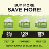 Purely Holistic Black Seed Oil bottle with softgels scattered around