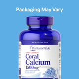 Puritan's Pride Coral Calcium capsules on a wooden surface
