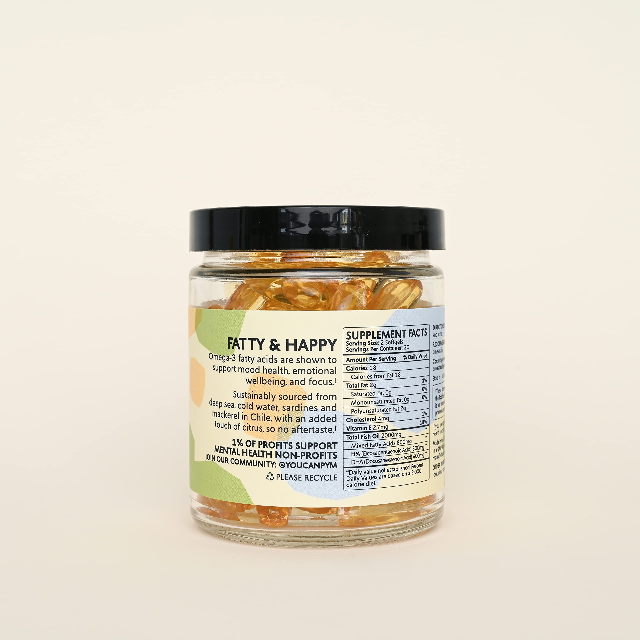 PYM Health Mood Omegas capsules in a glass of water