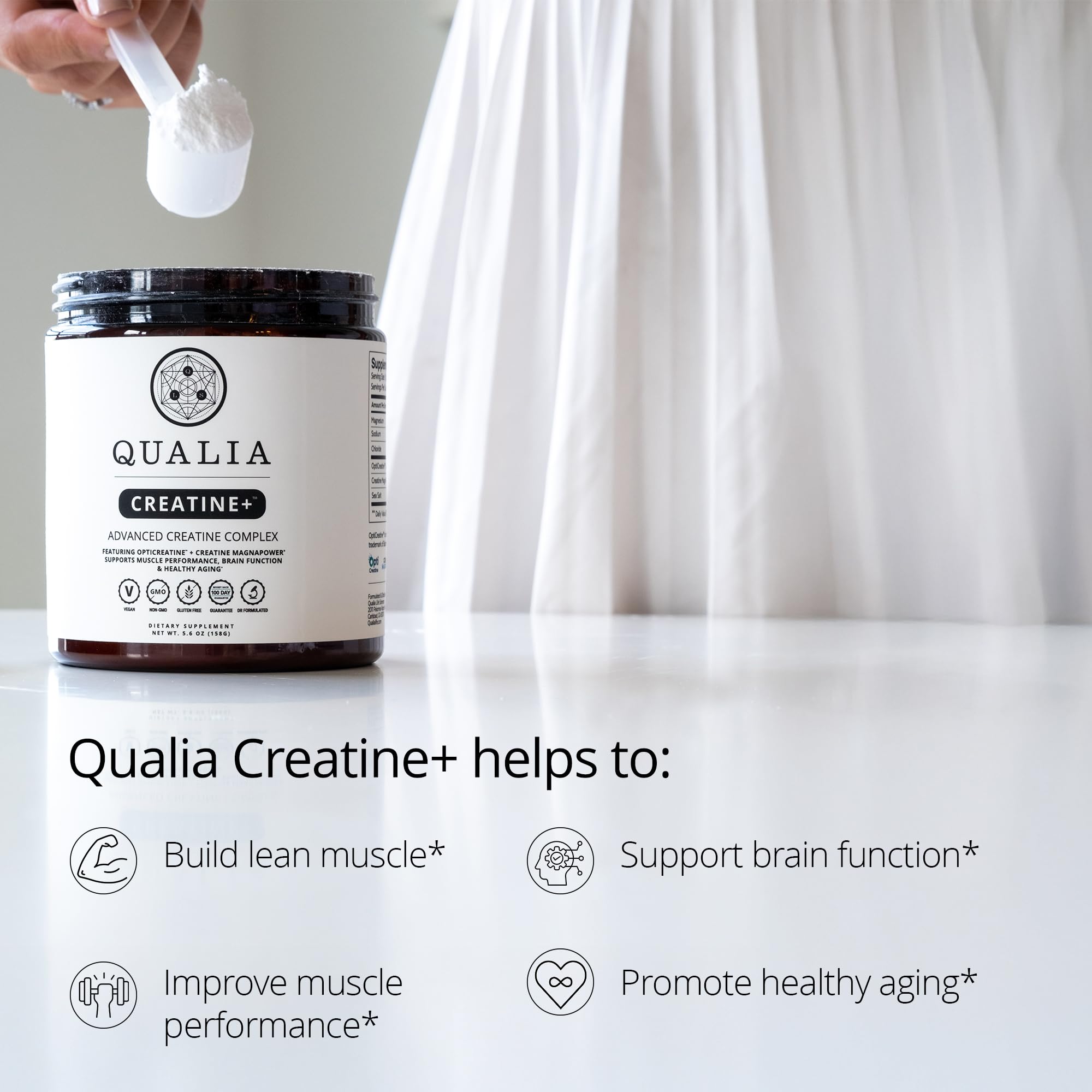 QUALIA LIFE SCIENCES Creatine+ scoop showing powder texture