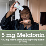 Quantum Sleep daily wellness Melatonin 5mg Herbal Sleep Aid 30 Capsules with a glass of water