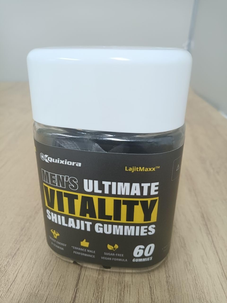 Quixiora Shilajit Gummies on a wooden table