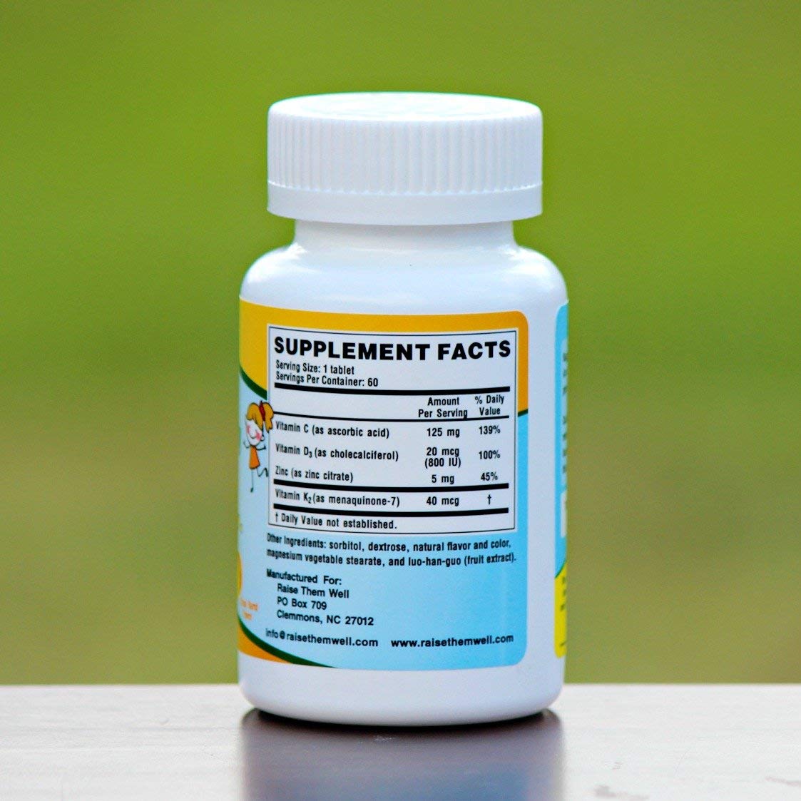Raise Them Well Multivitamins chewable tablets on a kitchen counter