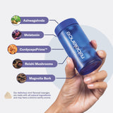 Rebalance Dream Sleep Mints with a glass of water on a nightstand
