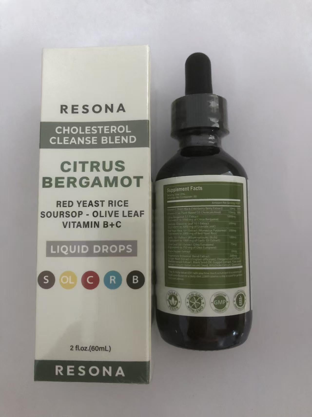 RESONA Red Yeast Rice Drops on a wooden table