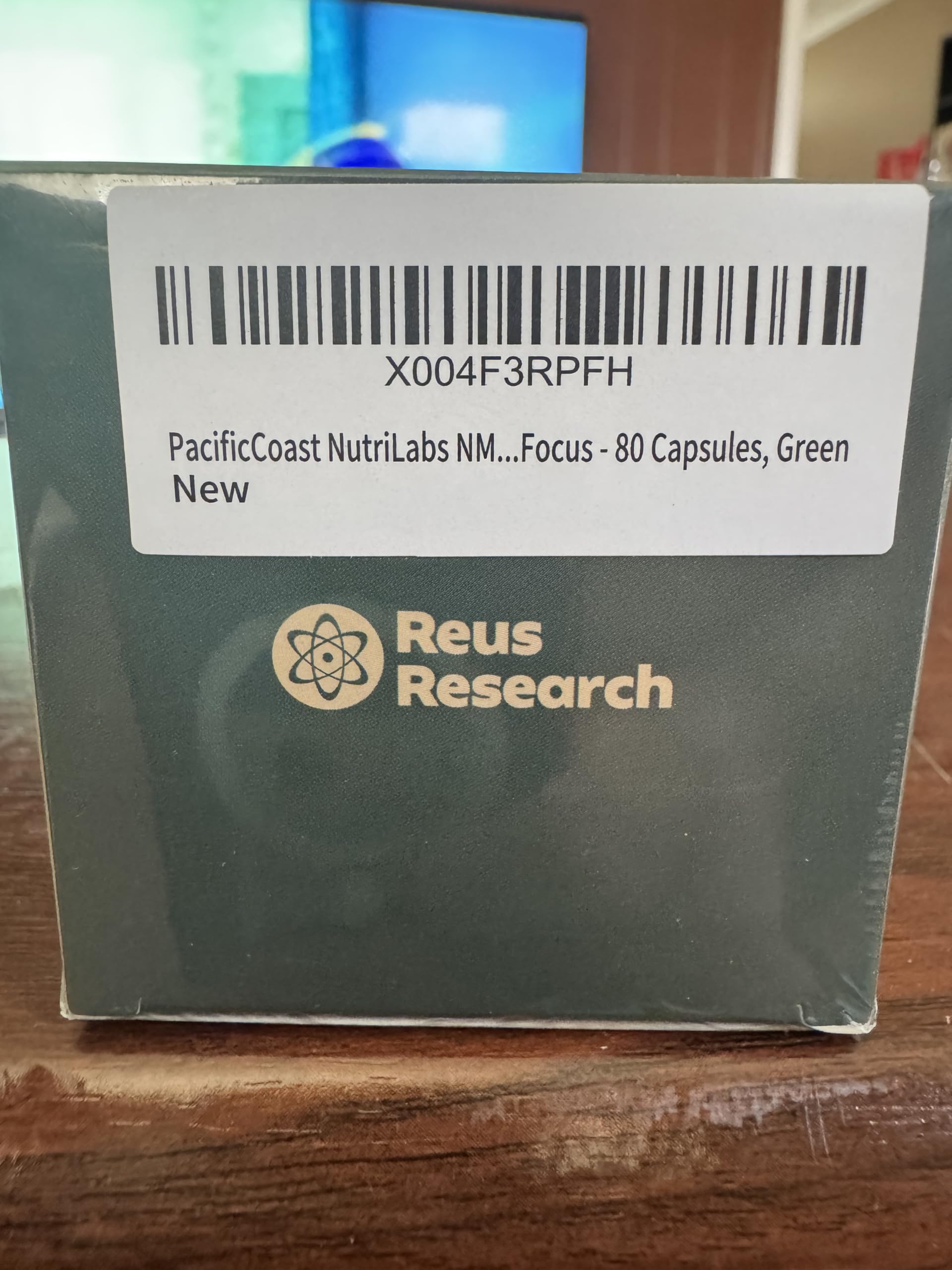 Reus Research Resveratrol Supplement on a wooden table