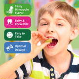 ReviNutra Kids Magnesium Gummies displayed with fresh pineapples