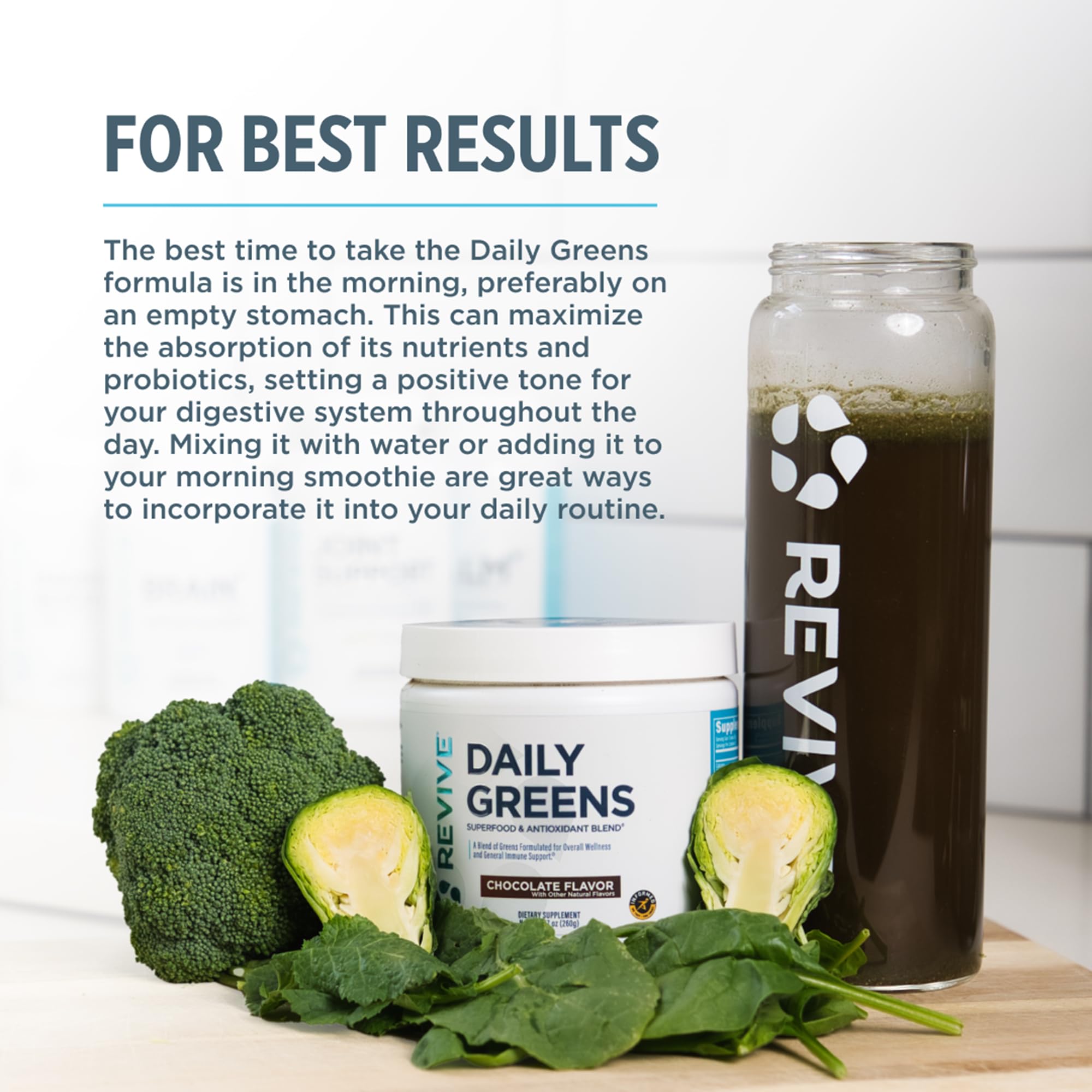Revive Daily Greens Chocolate Supplement in a glass of water