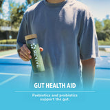 Revive Daily Greens Chocolate Supplement lifestyle scene with fruits