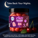 riev Extra Sleep Gummies dark red gummies on a wooden surface