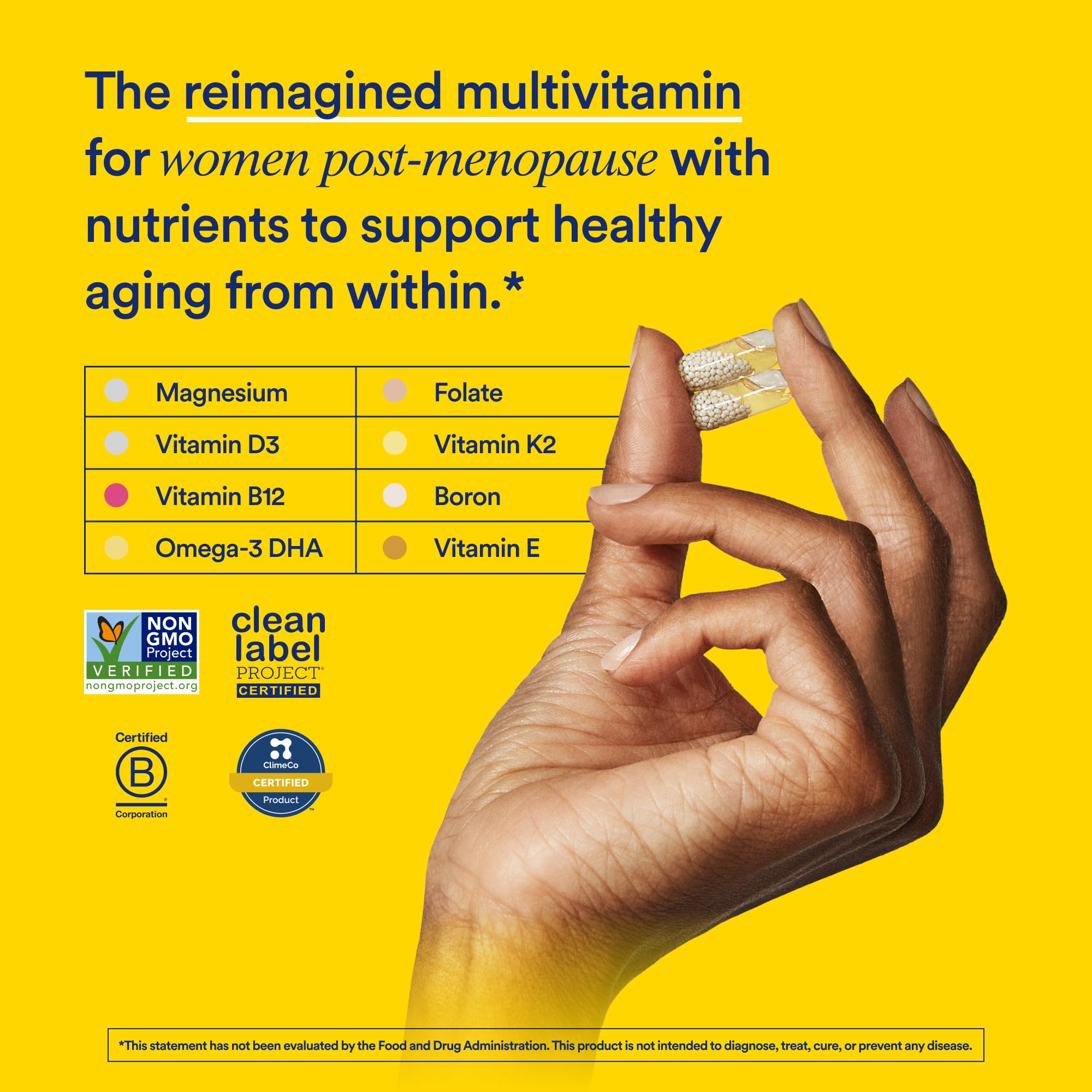 Ritual Essential for Women Multivitamin 50+ capsules on a wooden surface