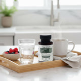 Sage & Self Berberine HCL supplement lifestyle shot on a wooden table