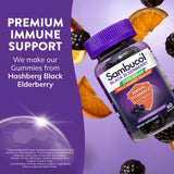 Sambucol Elderberry Gummies with fresh elderberries on a table