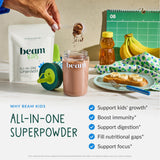 Scoop of Beam Kids Multivitamin with Greens powder on a spoon