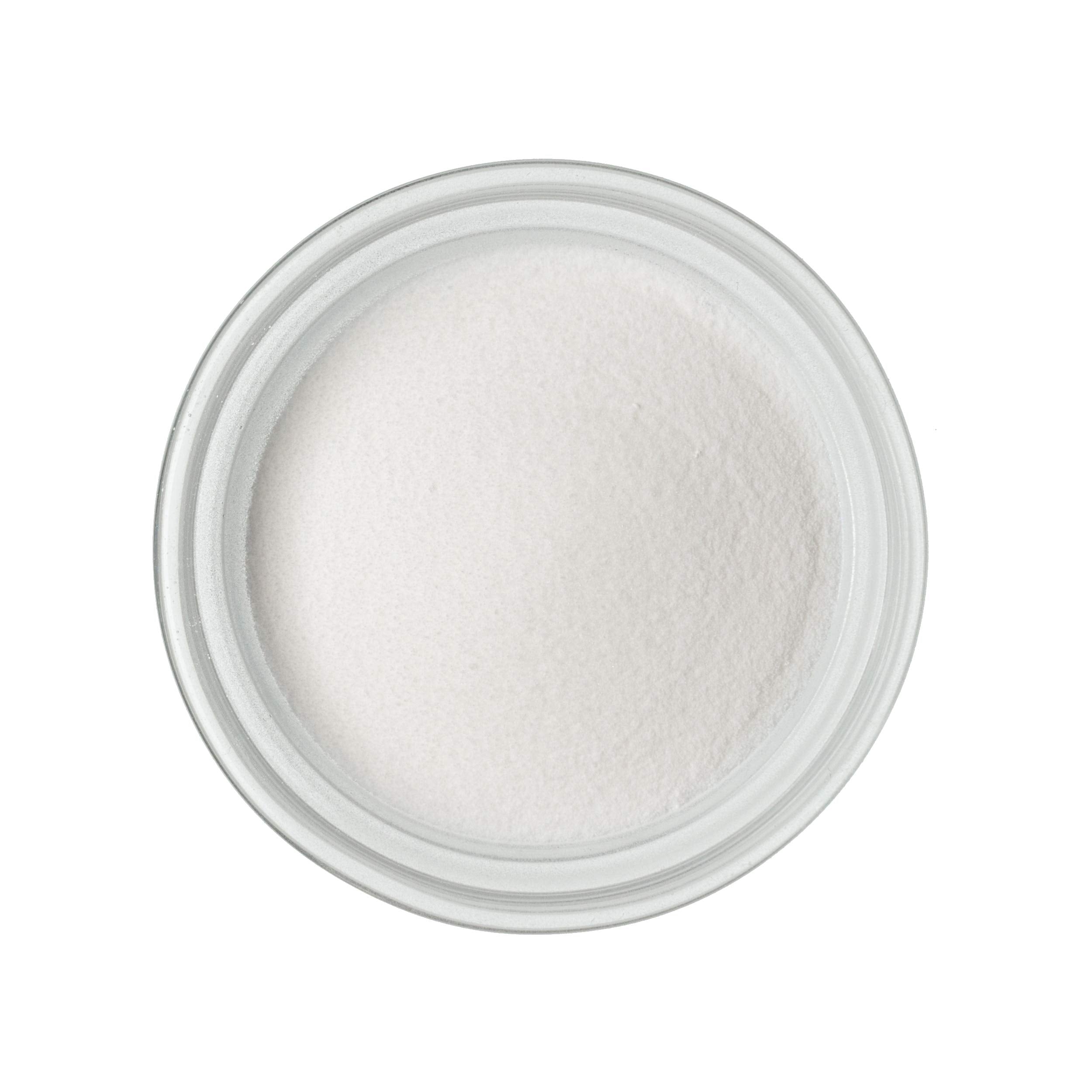 Scoop of Calcium Lactate Gluconate Powder on a kitchen counter