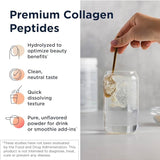 Scoop of Designs for Health Collagen Powder on a wooden spoon