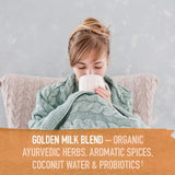 Scoop of Garden of Life Golden Milk Powder on a wooden spoon