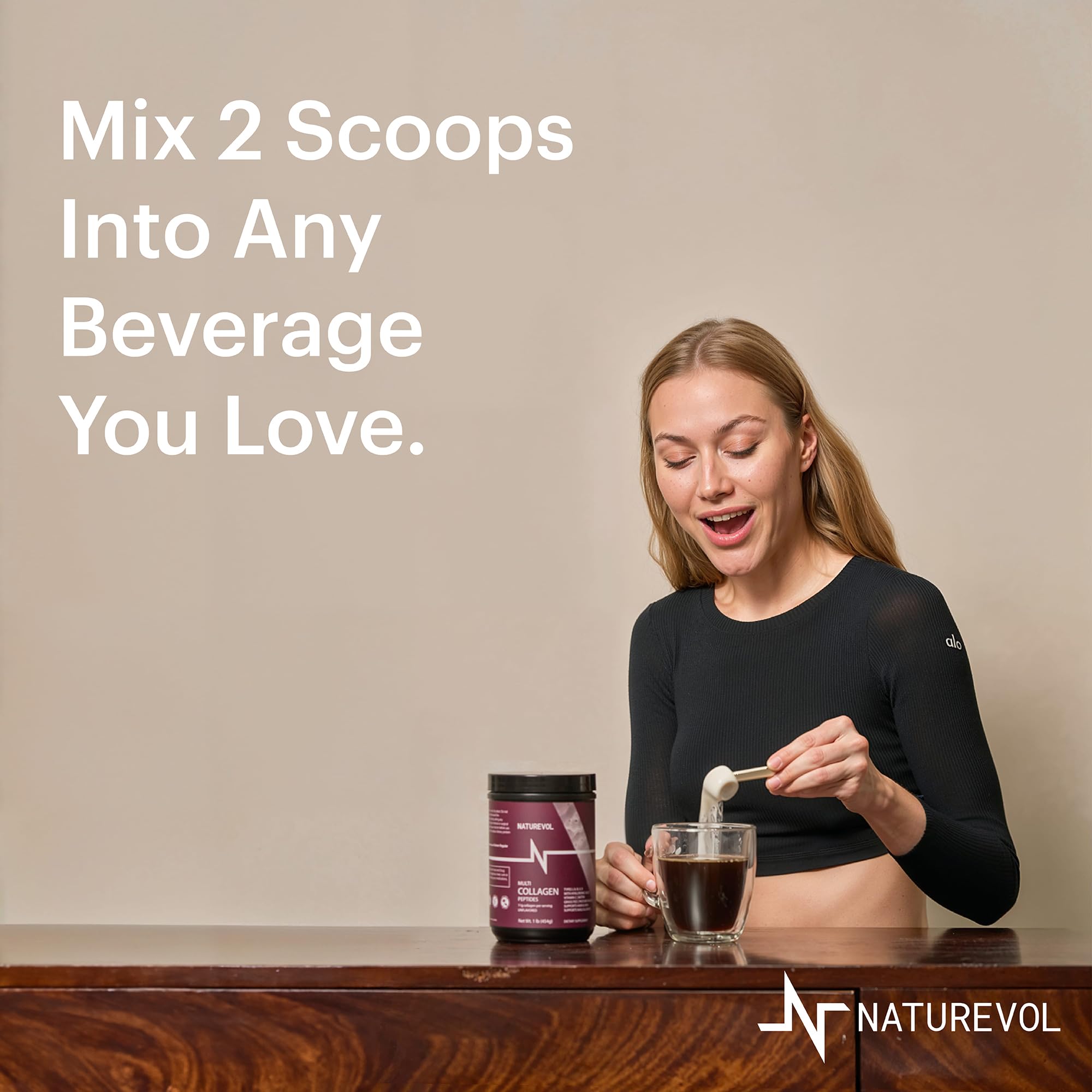 Scoop of NATUREVOL Collagen Powder on a wooden surface