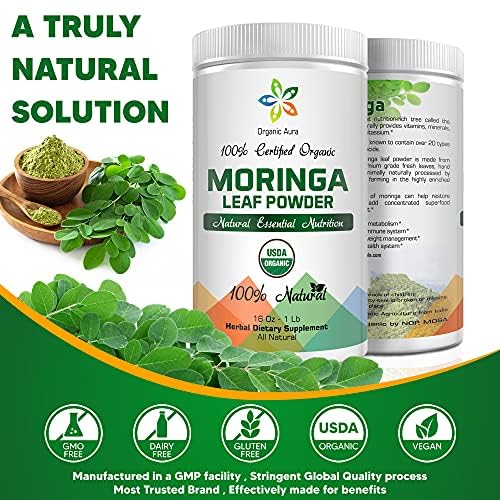 Scoop of Organic Aura Moringa Powder on a wooden spoon