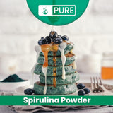 Scoop of PURE ORIGINAL INGREDIENTS Spirulina Powder on a wooden surface