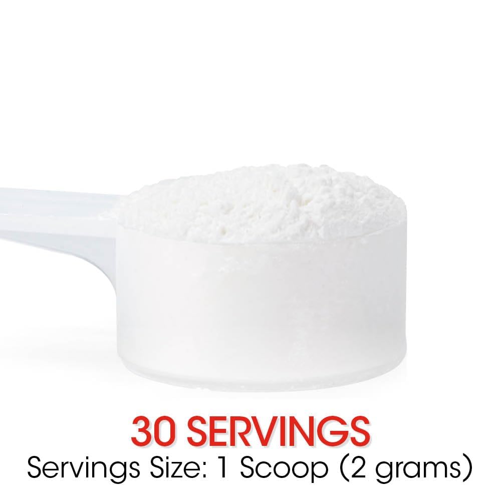 Scoop of Silver Fern Reflux powder on a wooden surface