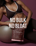 Scoop of Truvani Creatine Monohydrate powder on a table