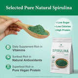 Scoop of VELOTO Spirulina Powder on a wooden spoon
