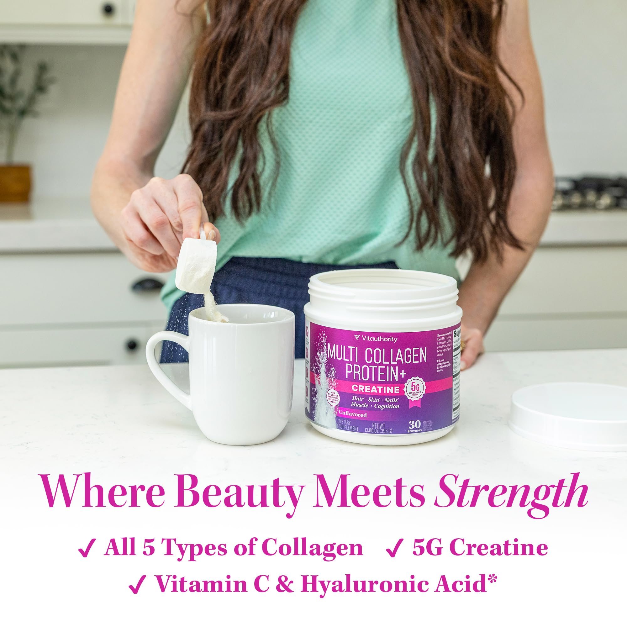 Scoop of Vitauthority Collagen Creatine Powder on a wooden table