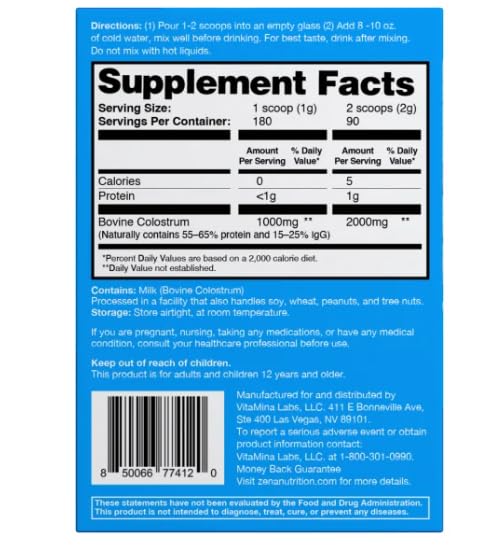 Scoop of ZENA Pure Colostrum Powder 2000mg on a wooden spoon