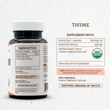 Secrets of the Tribe Thyme Capsules displayed on a wooden surface