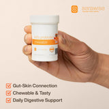 Serawise Kids Probiotic Chewable Tablets with a child's hand holding one