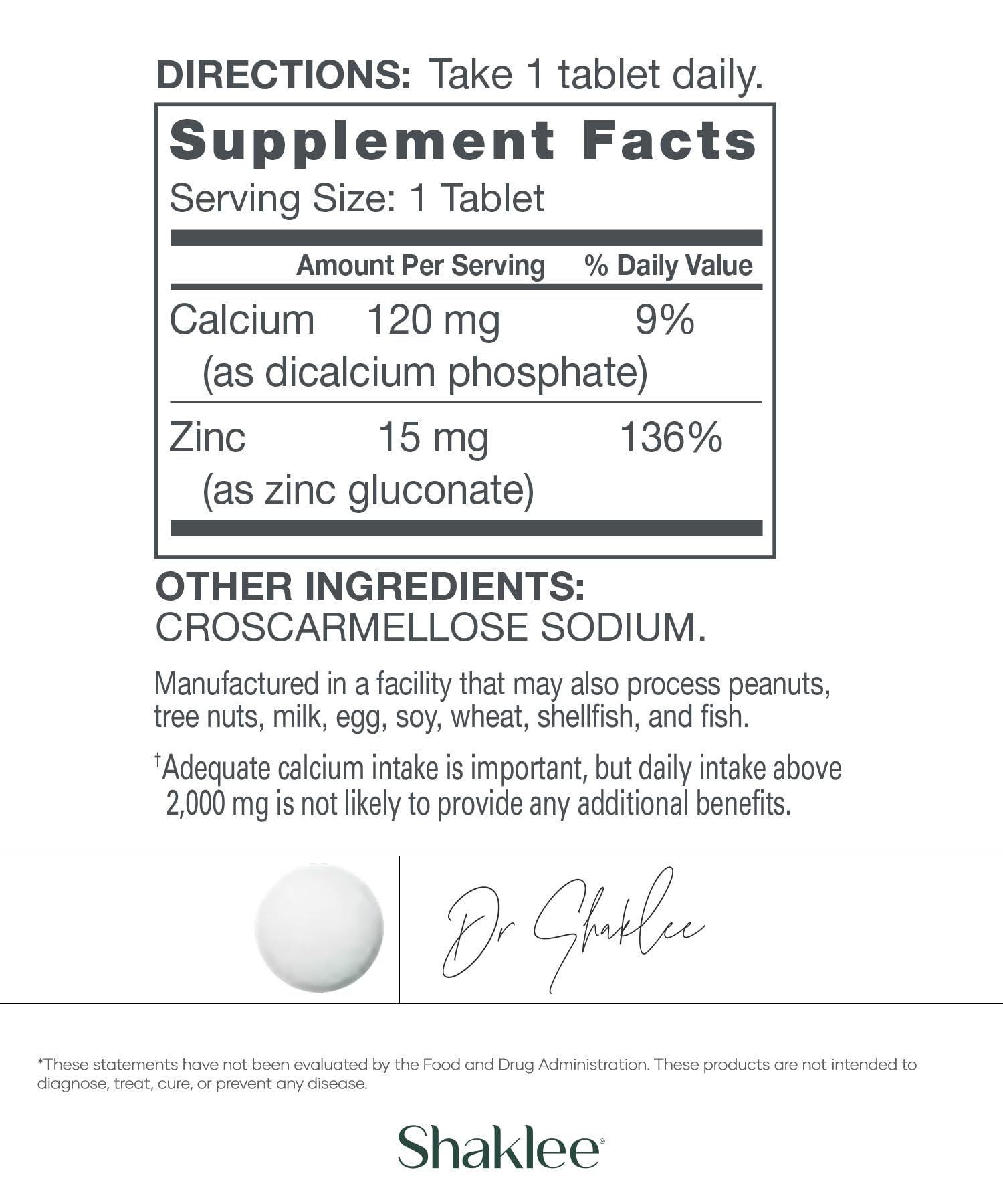 Shaklee Zinc tablets close-up on a wooden surface