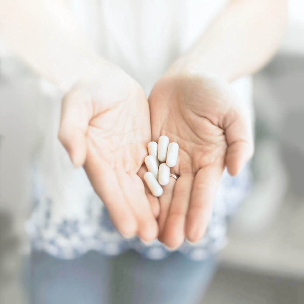 Silver Fern Probiotic Capsules 30 Count with a measuring spoon