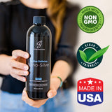 SilverCeuticals Nano Colloidal Silver 499g with a glass of water