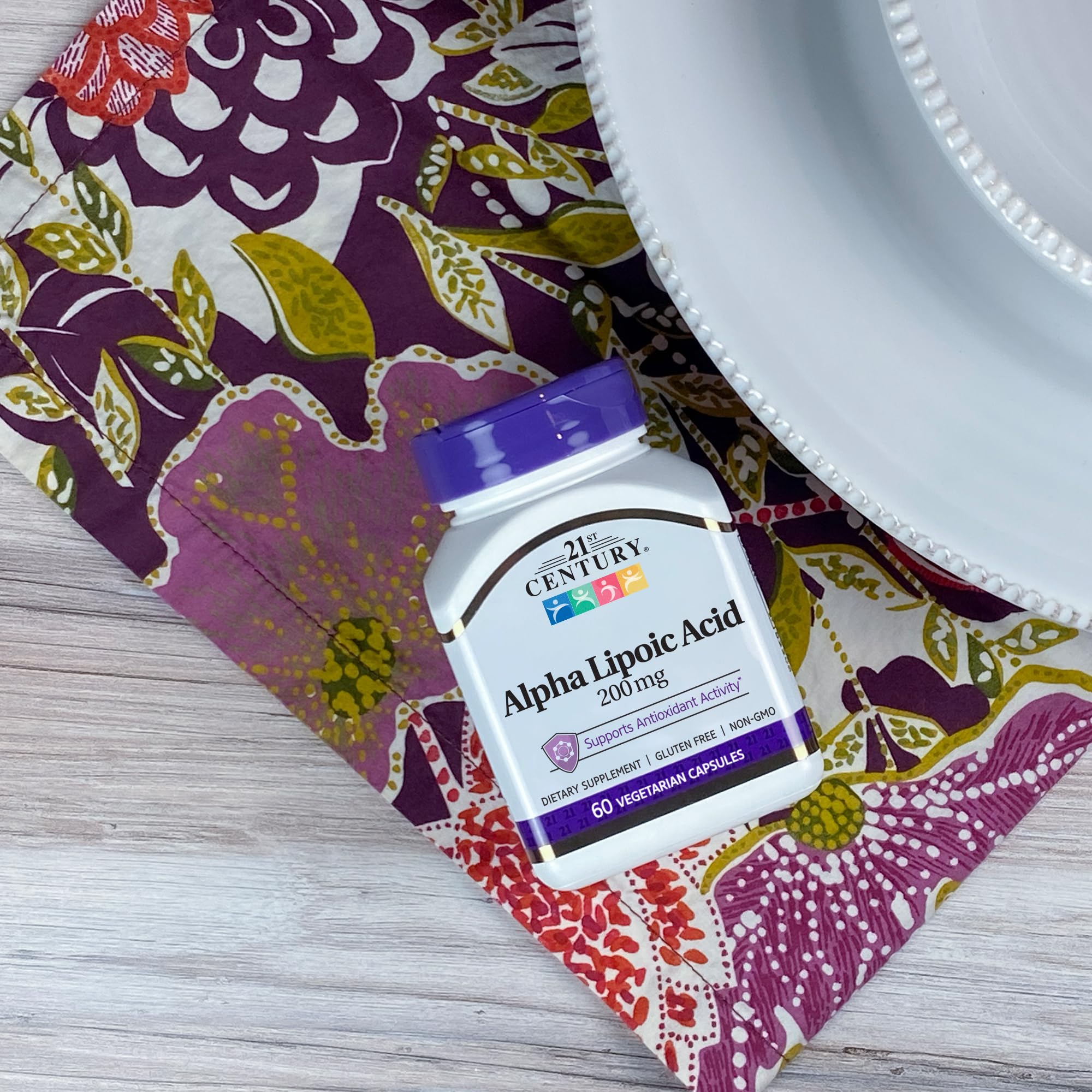 SMART MONKEY TECHNOLOGIES Alpha Lipoic Acid capsules on a wooden surface