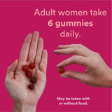SmartyPants Women's Multi & Omega Gummies on a wooden table